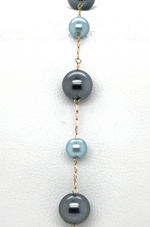 Blue pearls interspersed with 14k chain bracelet